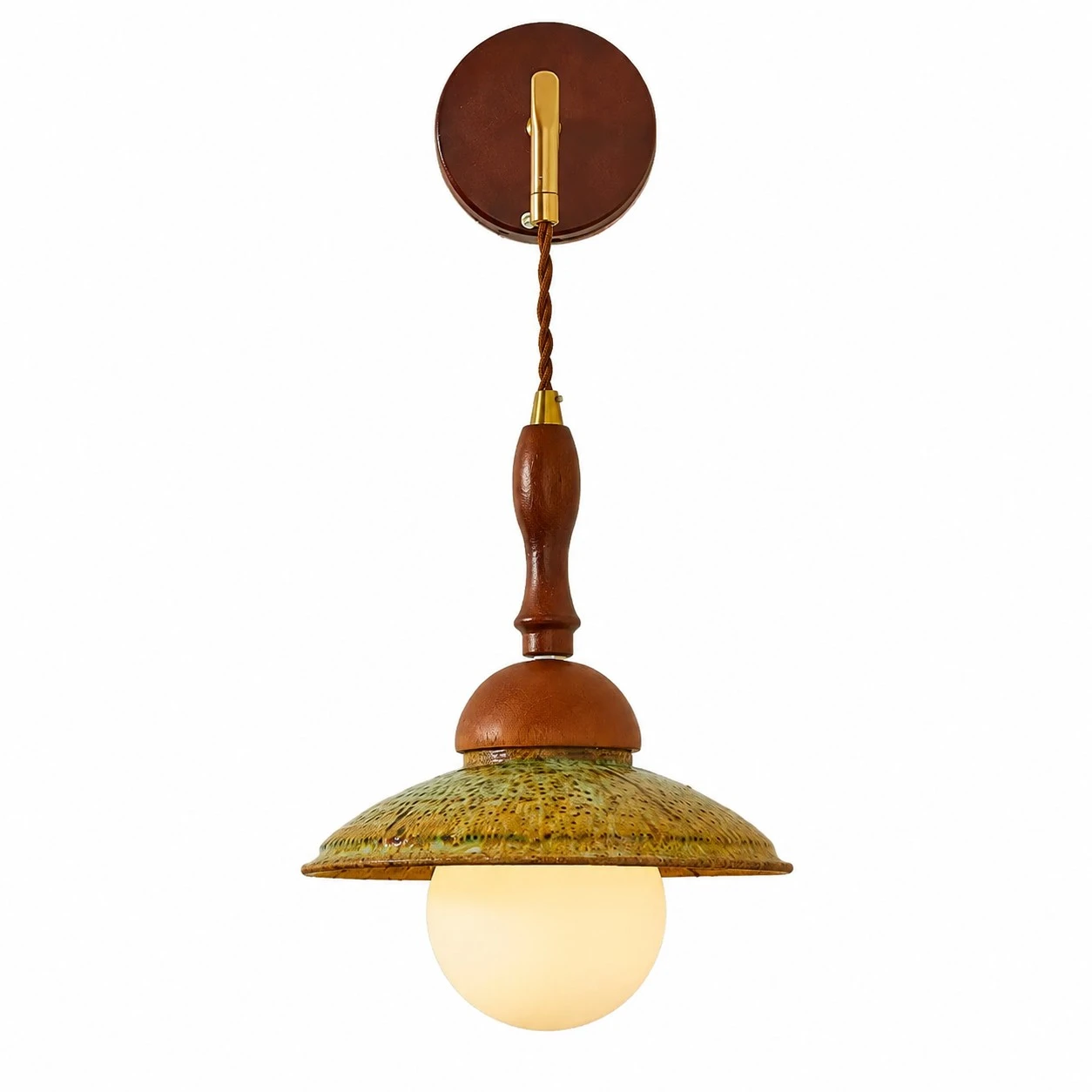 Japanese wabi sabi wall sconce with walnut wood wall plate, brass arm, green textured shade and frosted globe