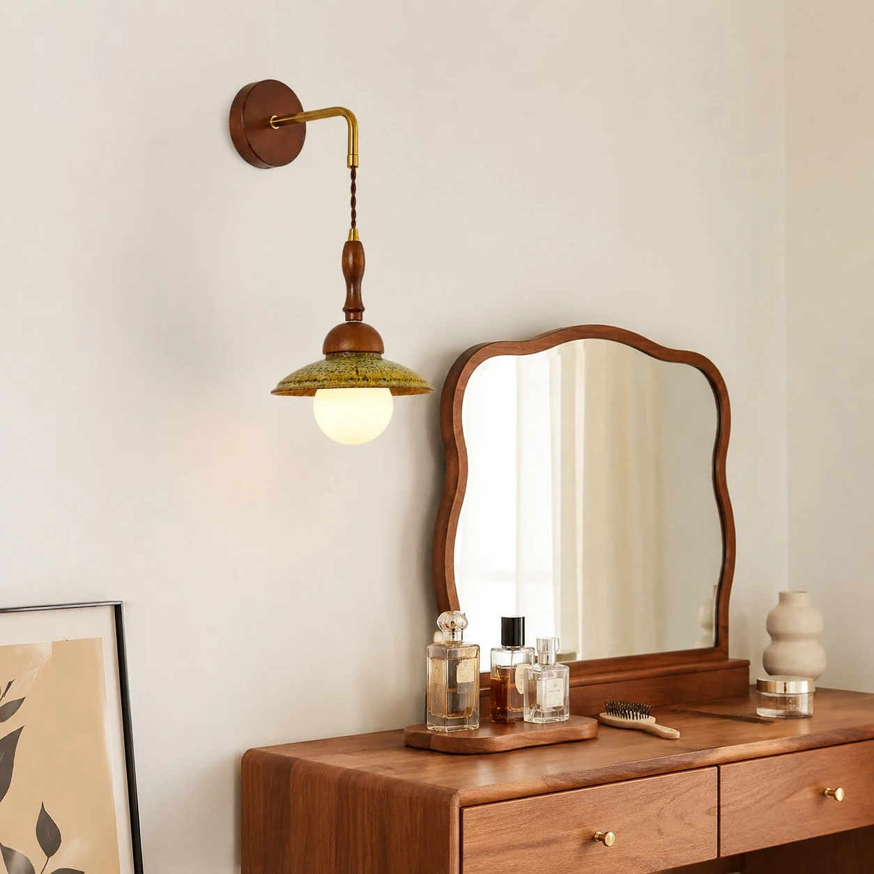 Wabi sabi wall light installed above a wooden dresser and mirror