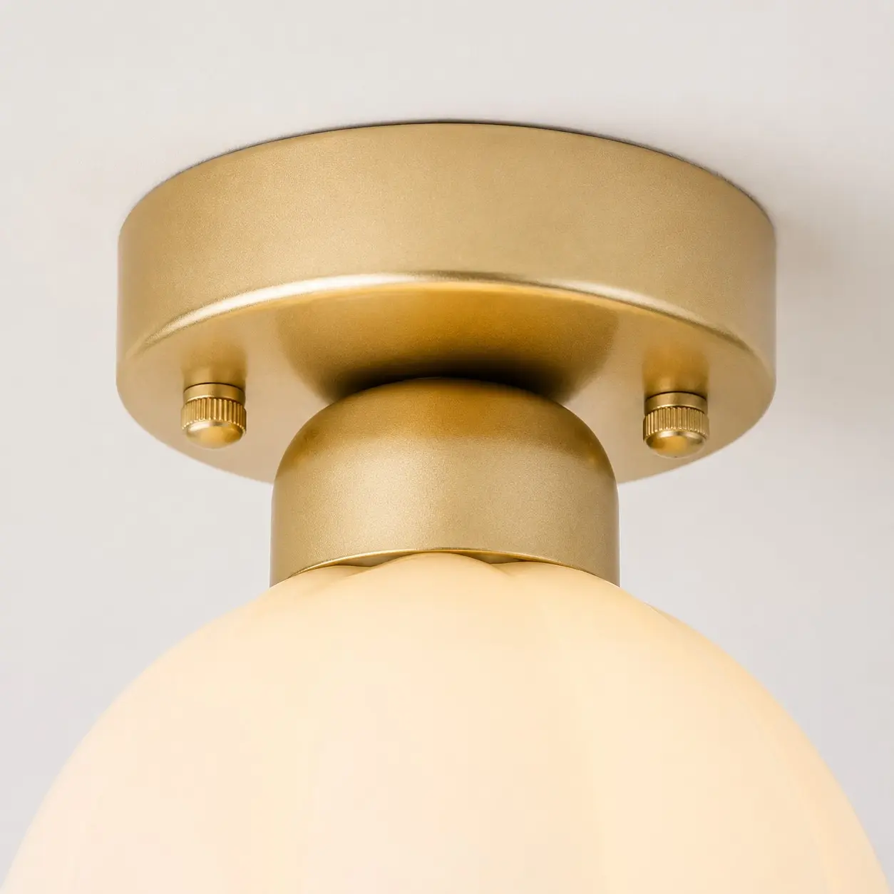 Gold-finish ceiling canopy and mounting hardware detail