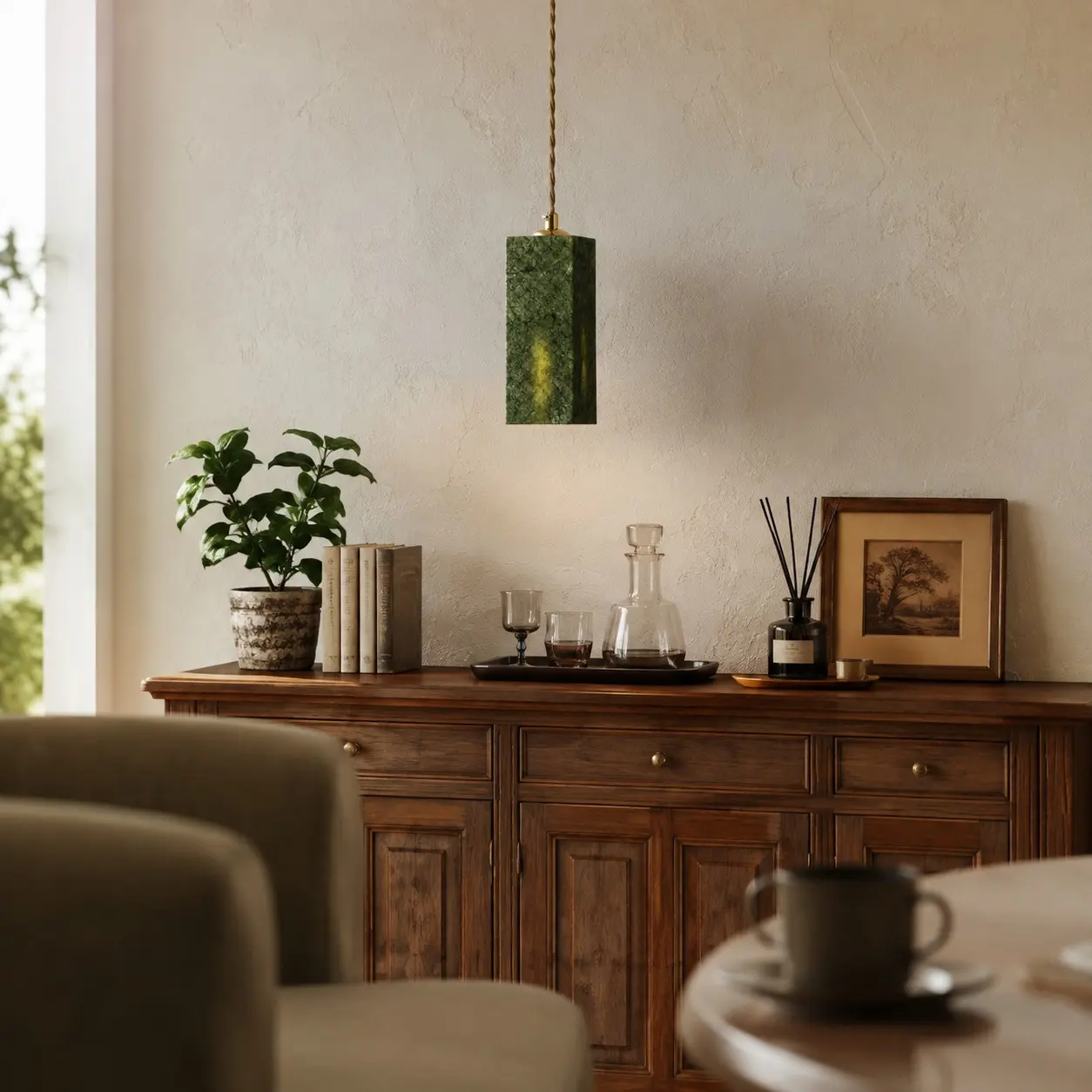 French vintage green pendant light above a sideboard